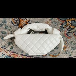 Croissant top handle bag